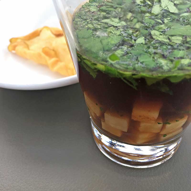 Cerleriac Beef Bouillon with Celeriac Chip at De Kas Restaurant in Amsterdam