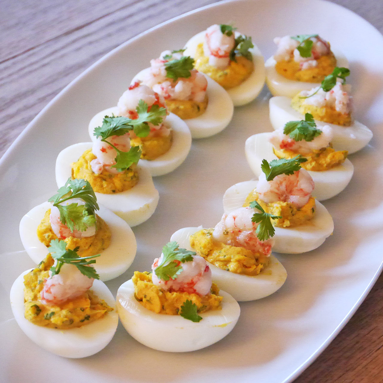 deviled eggs with shrimp on top